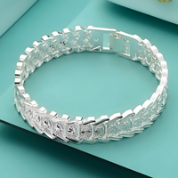 Wide Watch Strap Style Bracelet With Geometric Engraved Panels, Polished 1783
